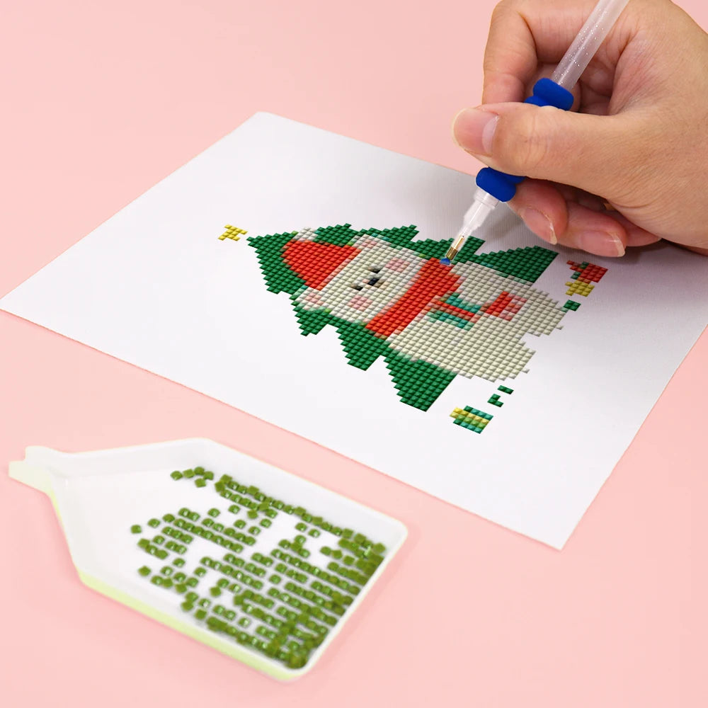 Close-up of drills being placed on a Christmas Tree Characters mini diamond painting design