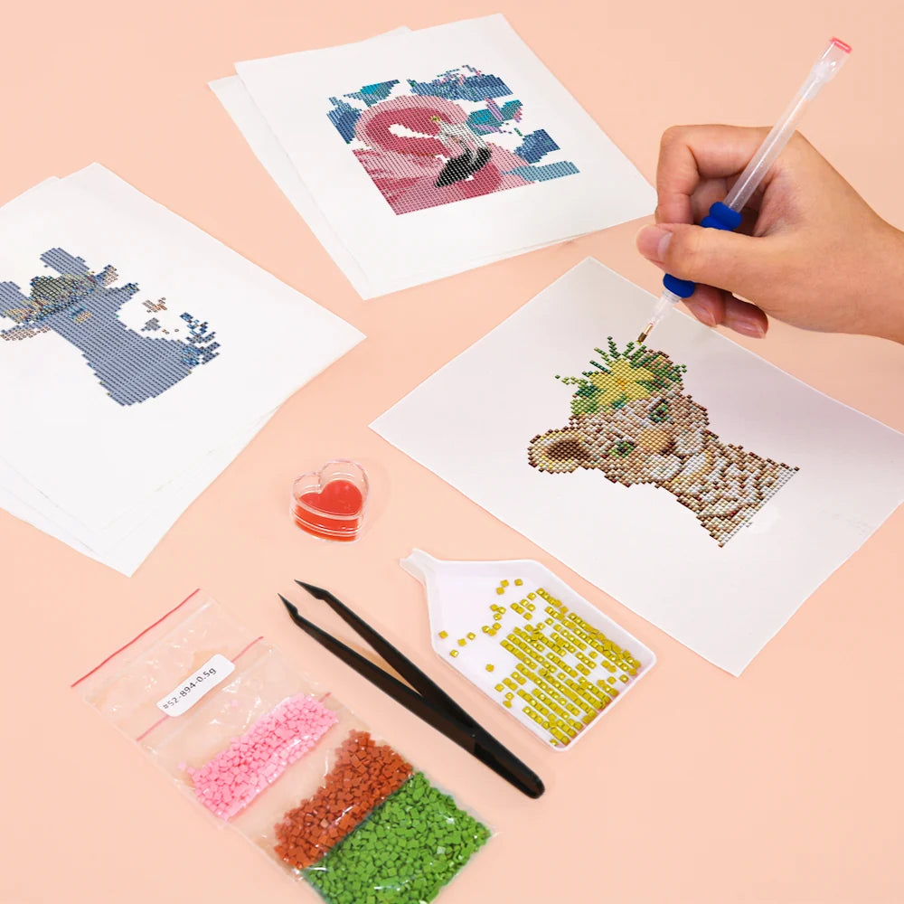 Working on several Colourful Animal Friends mini diamond painting designs with drills and applicator