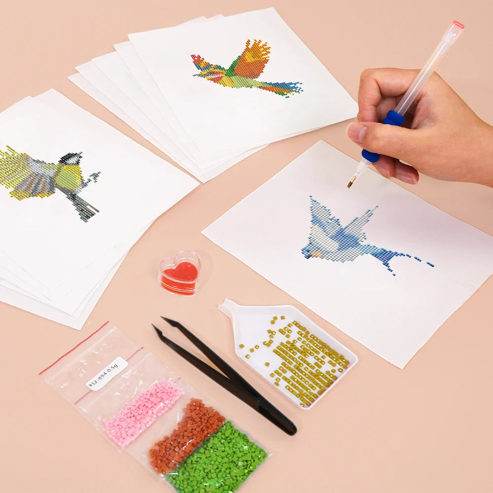 Working on several Colourful Birds mini diamond painting designs with drills and applicator