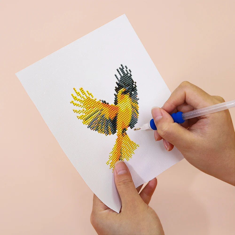 Applying drills to a Colourful Birds mini diamond painting design