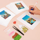 Working on several Colourful Travel Postcards mini diamond painting designs with drills and applicator