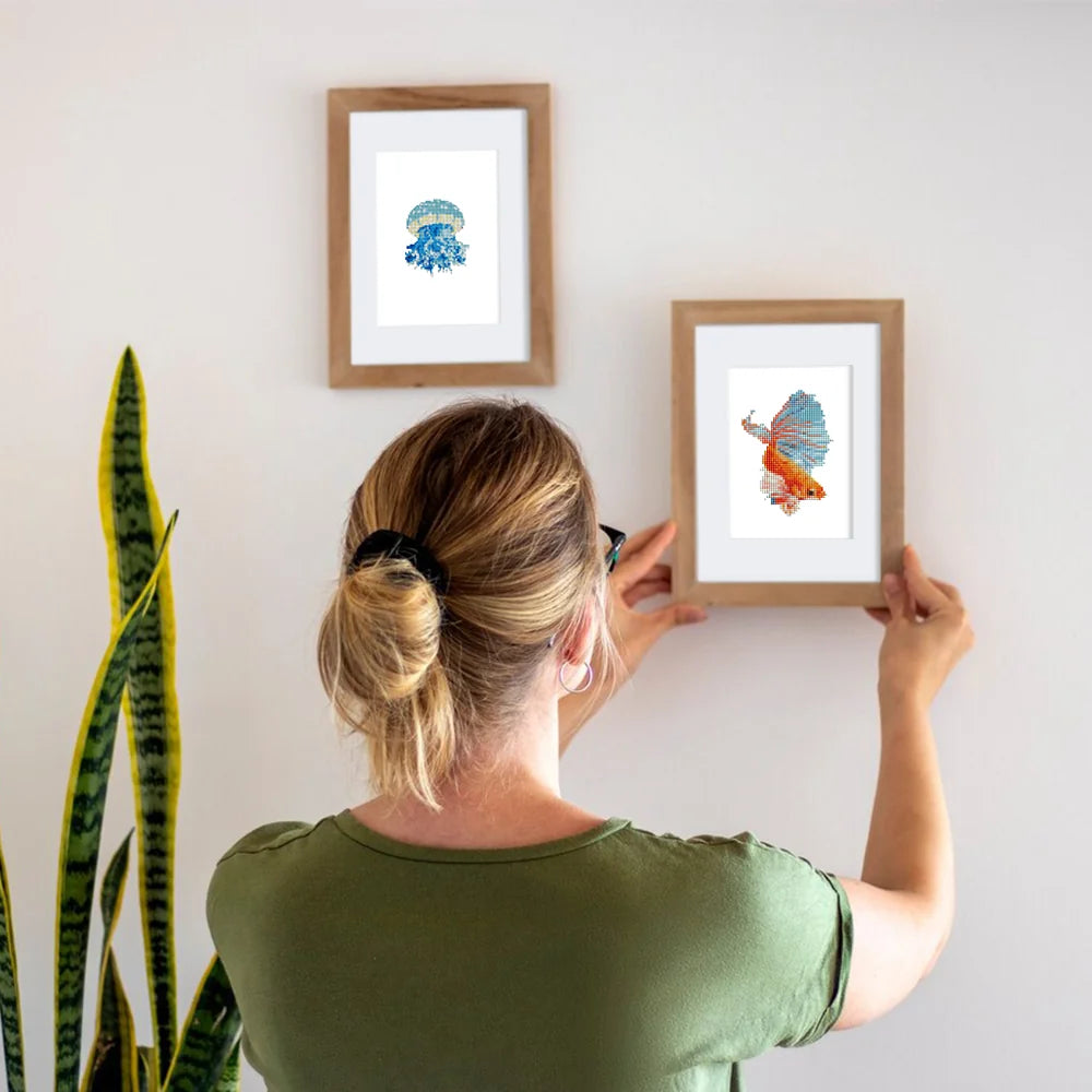 Framed Colourful Tropical Fish mini diamond painting artwork displayed in a styled setting