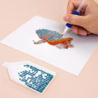 Close-up of drills being placed on a Colourful Tropical Fish mini diamond painting design