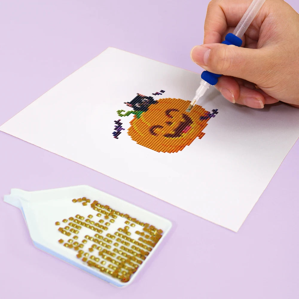 Close-up of drills being placed on a Cute Halloween Monsters mini diamond painting design