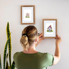 Framed Fairy Garden Cottages mini diamond painting artwork displayed in a styled setting