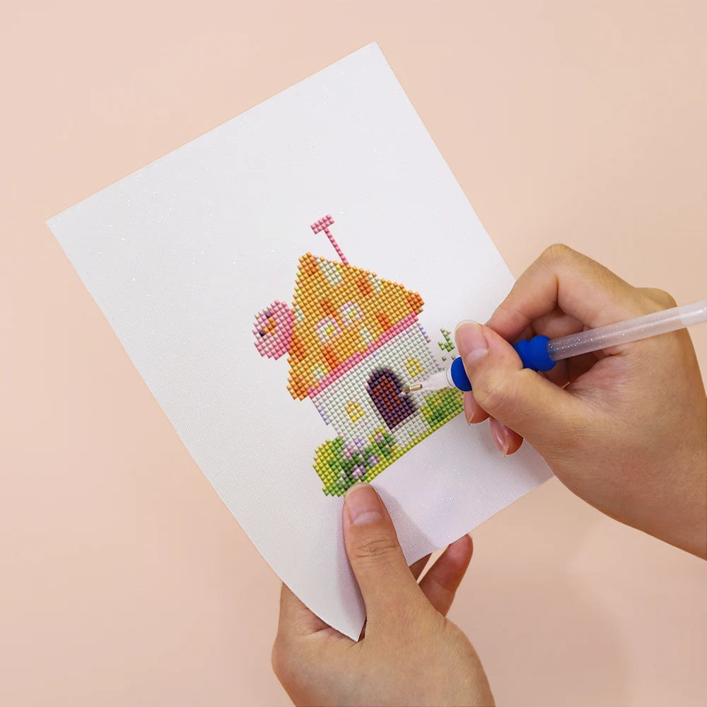 Applying drills to a Fairy Garden Cottages mini diamond painting design