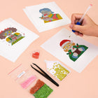 Working on several Festive Christmas Characters mini diamond painting designs with drills and applicator