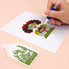 Close-up of drills being placed on a Festive Christmas Characters mini diamond painting design