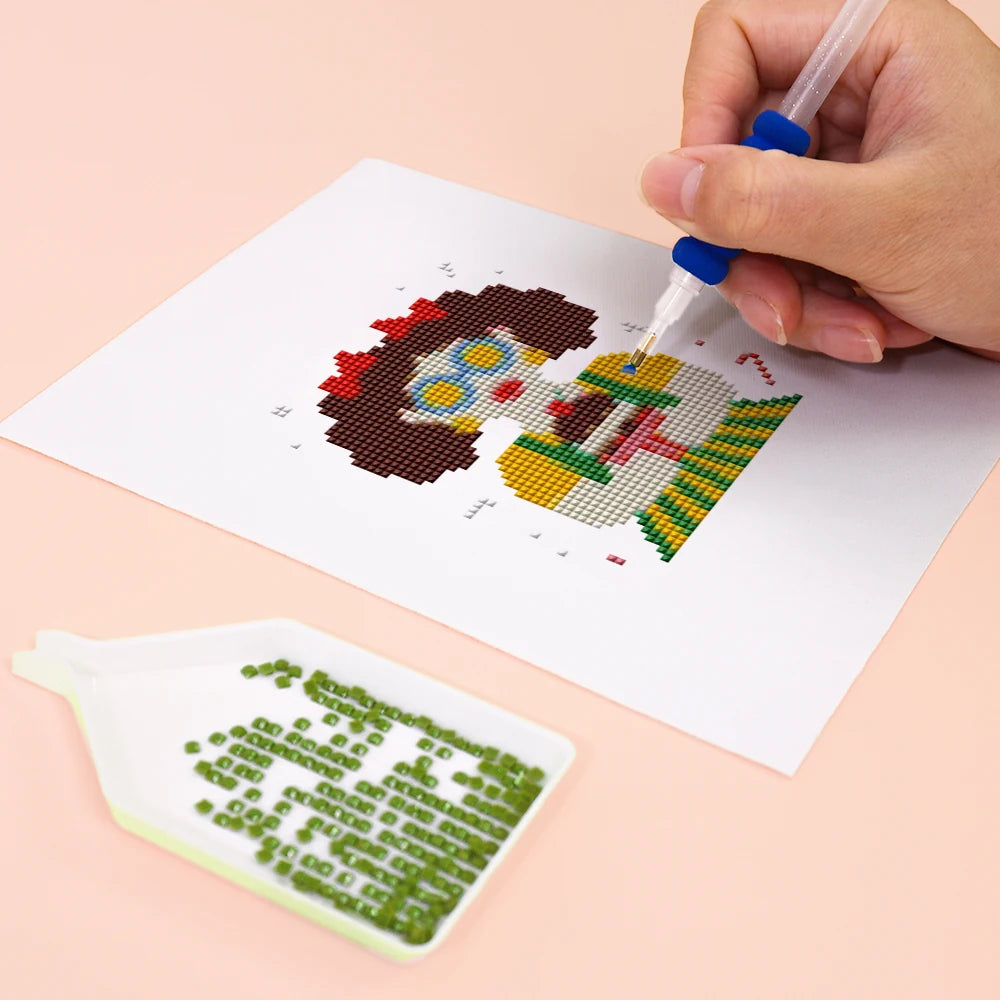 Close-up of drills being placed on a Festive Christmas Characters mini diamond painting design