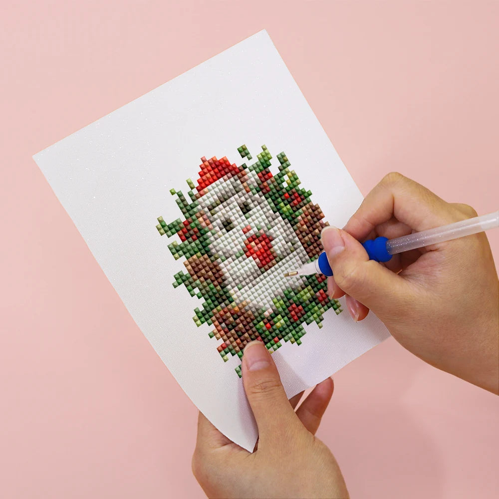 Applying drills to a Festive Woodland Friends mini diamond painting design