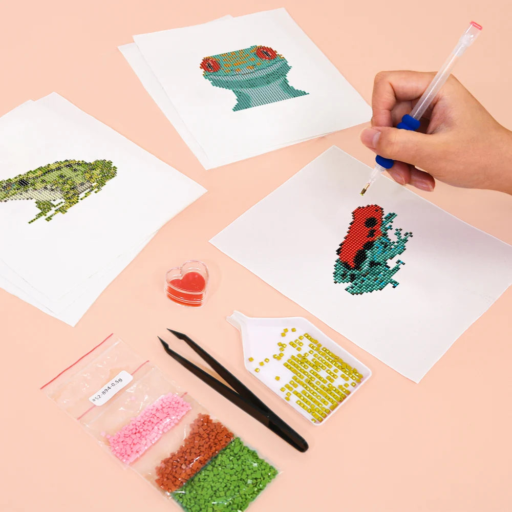 Working on several Frogs, Lizards & Chameleons mini diamond painting designs with drills and applicator
