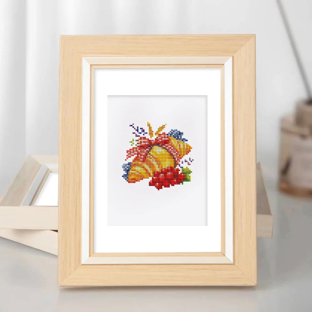 Framed Garden Harvest & Wreaths mini diamond painting artwork displayed in a styled setting