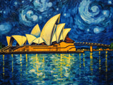 Illuminated waterfront building with multiple sail-like roof forms in nighttime