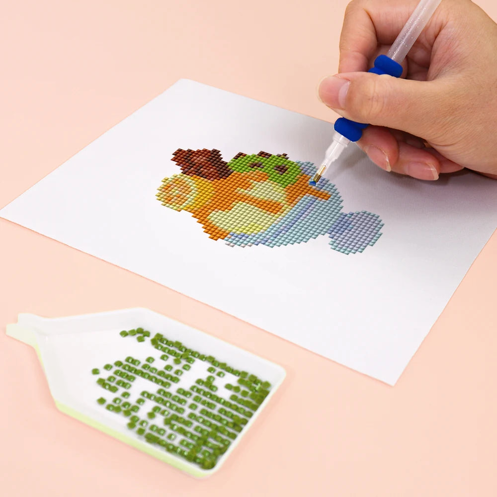 Close-up of drills being placed on a Pastel Desserts mini diamond painting design