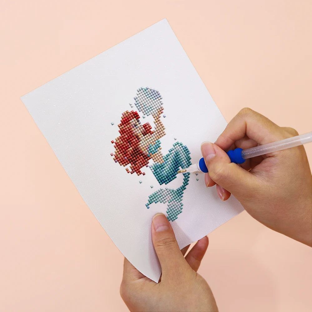 Applying drills to a Pastel Mermaids mini diamond painting design