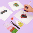 Working on several Spooky Halloween Icons mini diamond painting designs with drills and applicator