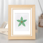 Framed Star Blooms mini diamond painting artwork displayed in a styled setting