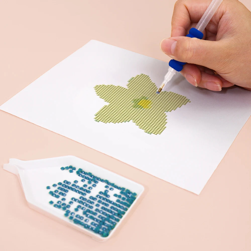 Close-up of drills being placed on a Star Blooms mini diamond painting design