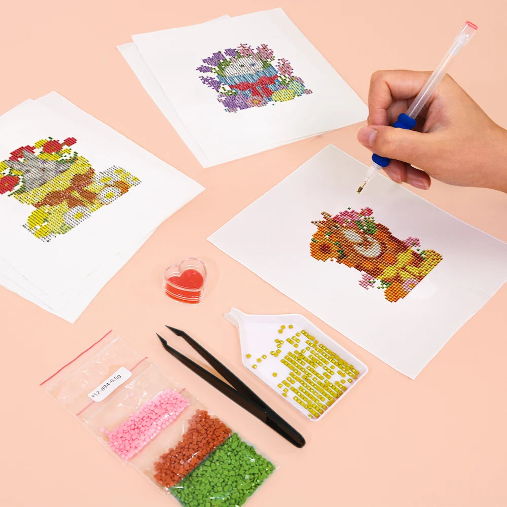 Working on several Whimsical Woodland Friends mini diamond painting designs with drills and applicator
